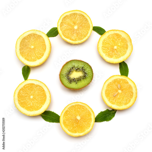 Lemon sliced and kiwi with leaves isolated on white background. Flat lay, top view