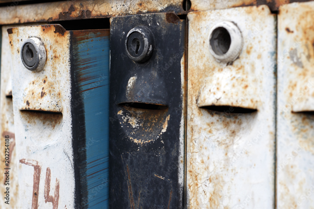 Old rusty mailboxes, like enthusiastic faces waiting for letters Old rusty mailboxes, like enthusiastic faces waiting for letters