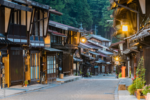 Narai-juku, Japan - September 4, 2017: Picturesque view of old Japanese town with traditional wooden architecture. Narai-juku post town in Kiso Valley, Japan © torsakarin