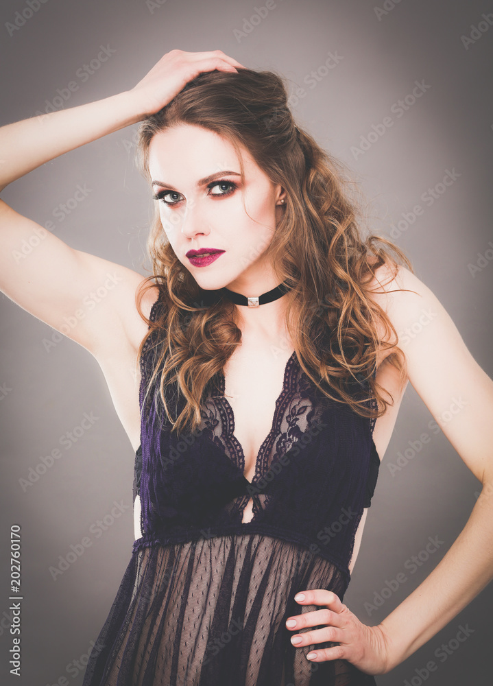 Portrait of beautiful young woman face. Isolated on gray background. Portrait of beautiful young woman face. Isolated on gray background.