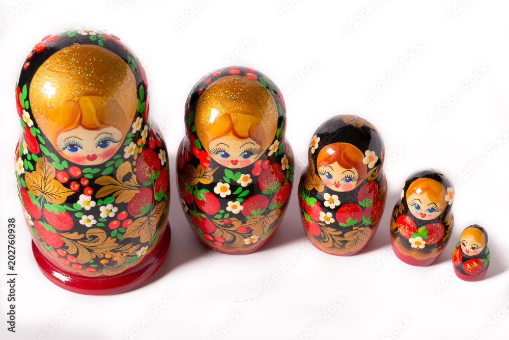 Fototapeta premium Русская народная игрушка. Матрешка на белом фоне.