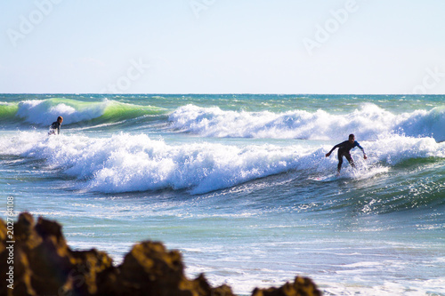Surfer in the Atlantic Ocean. The coast of Agadir. Morocco
