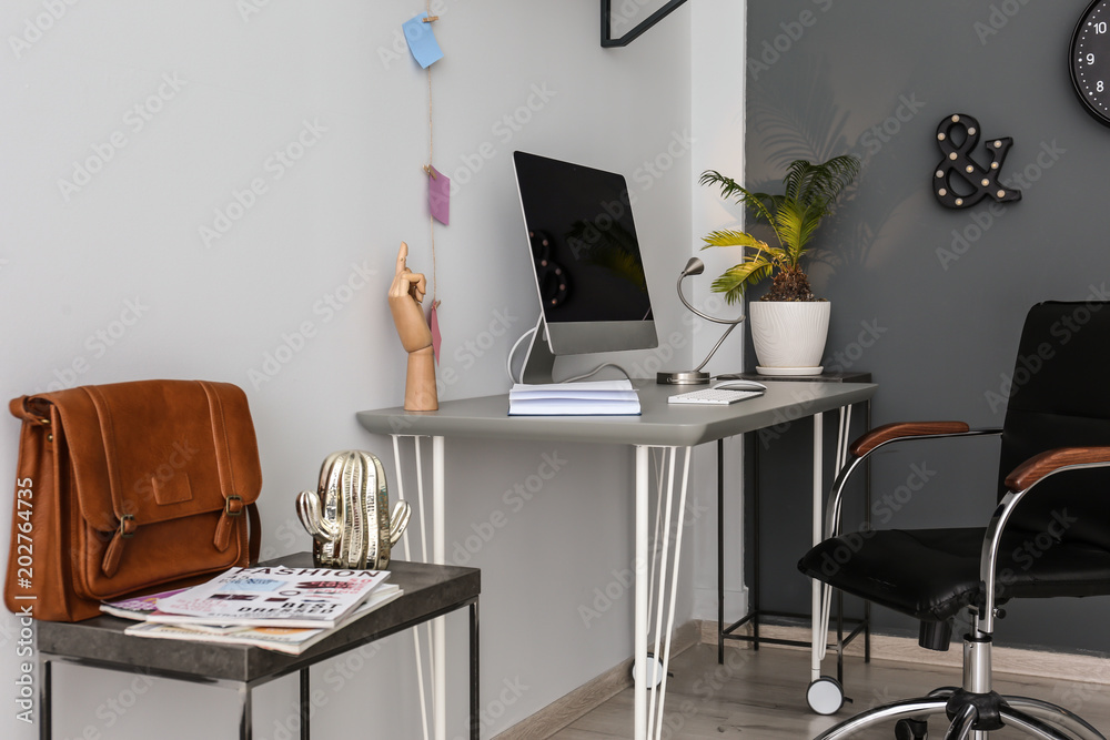 Comfortable workplace with computer on desk in home office Comfortable workplace with computer on desk in home office