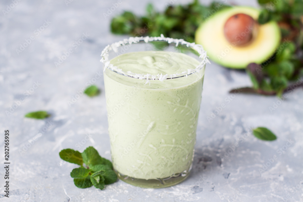 Healthy green milkshake or smoothie with avocado and mint Healthy green milkshake or smoothie with avocado and mint