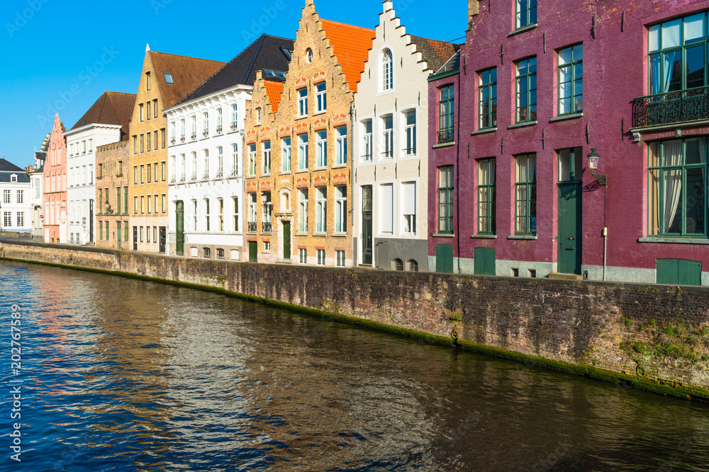 View of a canal and old historical buildings in Bruges, Belgium