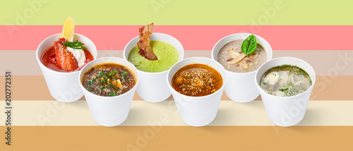 Set of various restaurant soups on colorful background