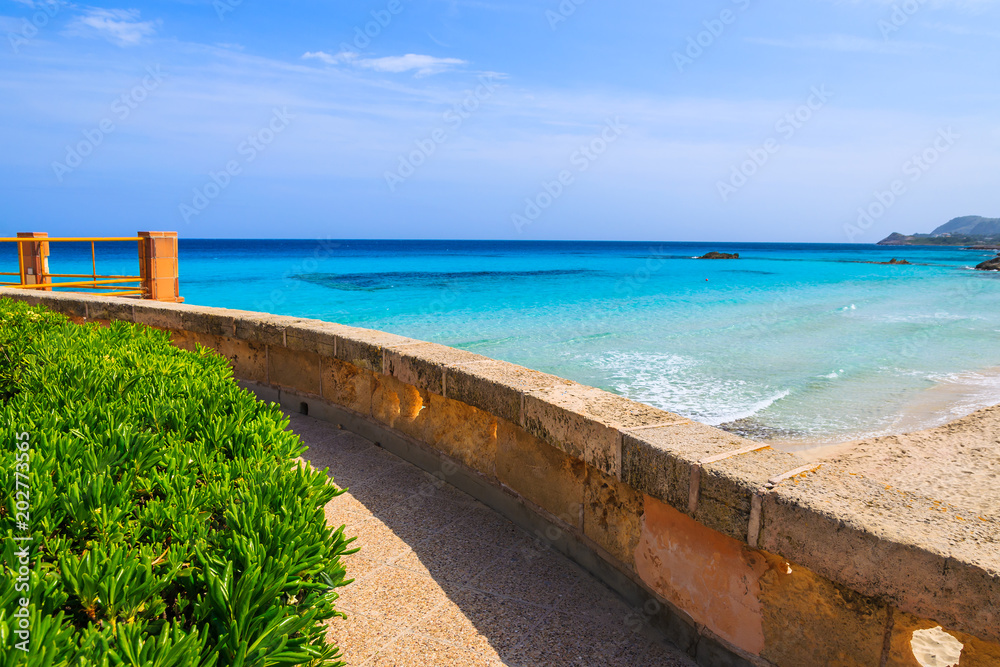 Coastal path along beautiful bay with beach, Majorca island, Spain