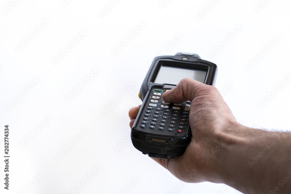 Barcode scanner in hand on white isolate background Barcode scanner in hand on white isolate background