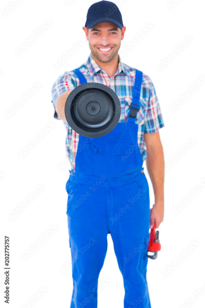 Handyman holding plunger and wrench on white background