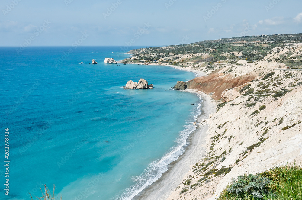 Sea and mountains landscape view. Light blue water and white rocks. Cyprus, Mediterranean Sea. Aphrodite beach. Summer, travel, vacation concept. Copyplace, place for text