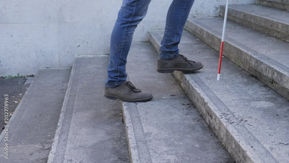 Blind Man Walking And climbing Stairs In City Blind Man Walking And climbing Stairs In City