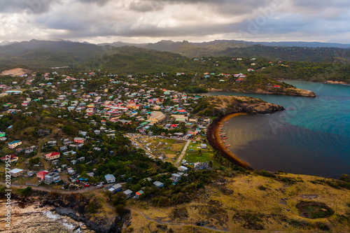 Aerial View of a Village, Hills, Valleys and a Rustic Caribbean Beach, in St. Lucia
