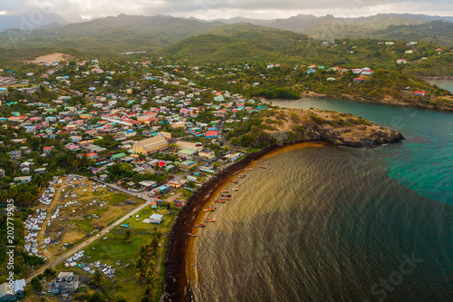 Aerial View of a Village, Hills, Valleys and a Rustic Caribbean Beach, in St. Lucia