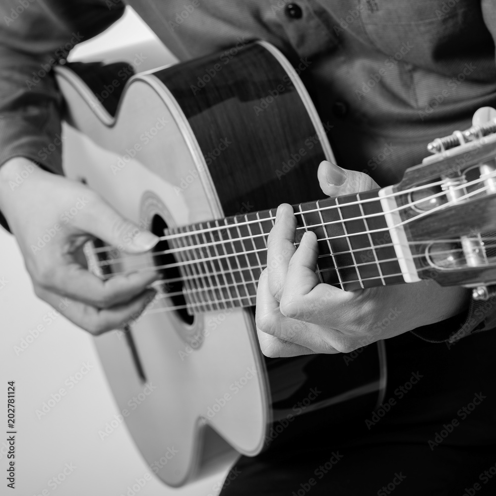 Fototapeta premium Man Playing Classic Guitar from THAILAND isolated for white background