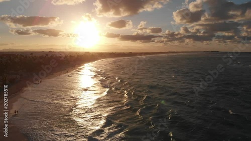 Tropical beach and waves sunset
