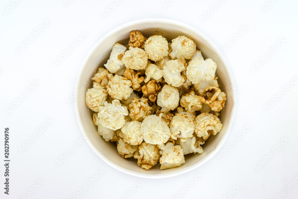 Top View of Caramel Popcorn in Cup on White Background Top View of Caramel Popcorn in Cup on White Background