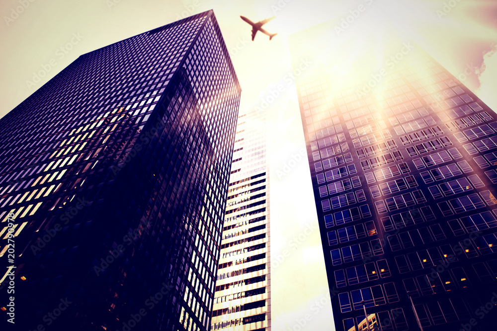 Star against low angle view of skyscrapers