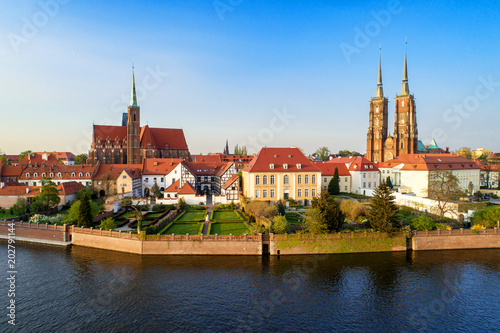 Poland. Wroclaw. Ostrow Tumski, Gothic cathedral of St. John the Baptist, Collegiate Church of the Holy Cross and St. Bartholomew and Odra (Oder) River. Aerial view in sunset light