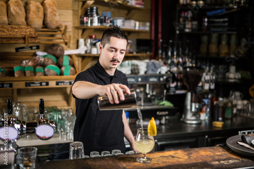 Barista making lemonade cocktail