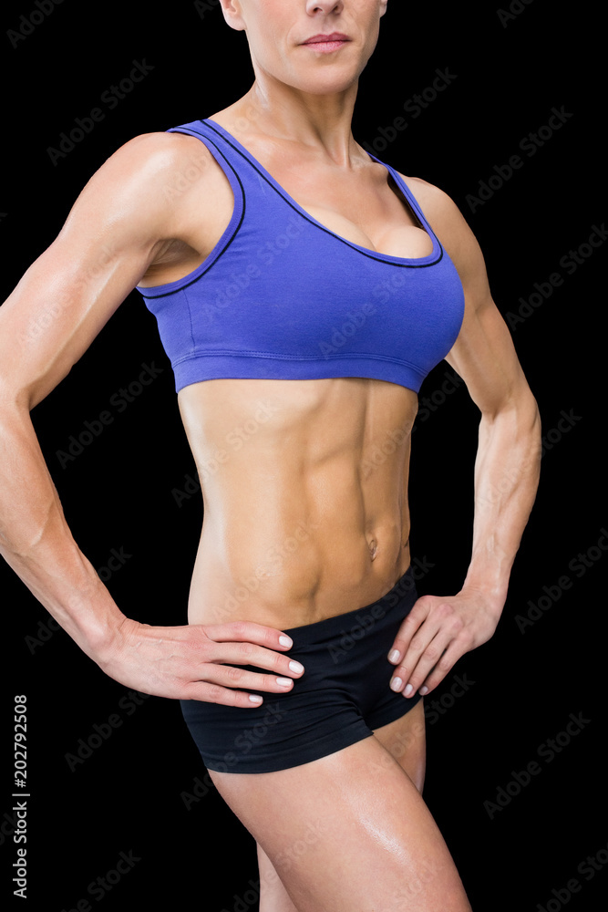 Strong woman posing with hands on hips Strong woman posing with hands on hips