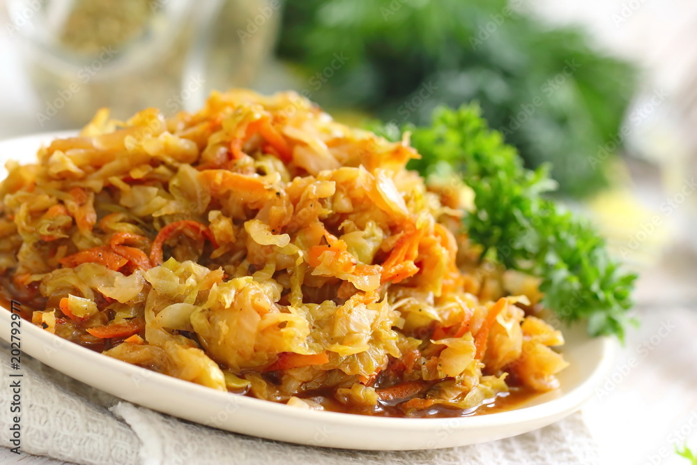 Stewed cabbage served on the table and prepared for eating. Vegetarian food Stewed cabbage served on the table and prepared for eating. Vegetarian food