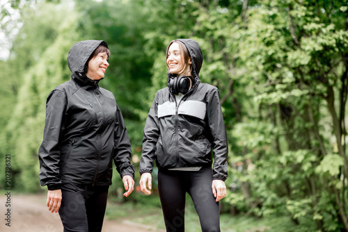 Two sports women talking in the park