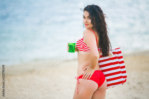 Young attractive woman on the beach