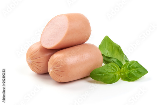 Fresh Bavarian sausages with basil, isolated on white background.