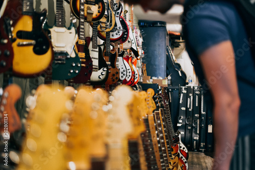 Man in Guitar Shop