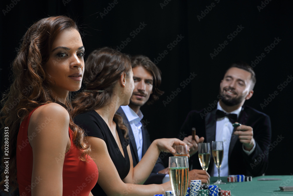 brunette girl in the casino playing poker brunette girl in the casino playing poker