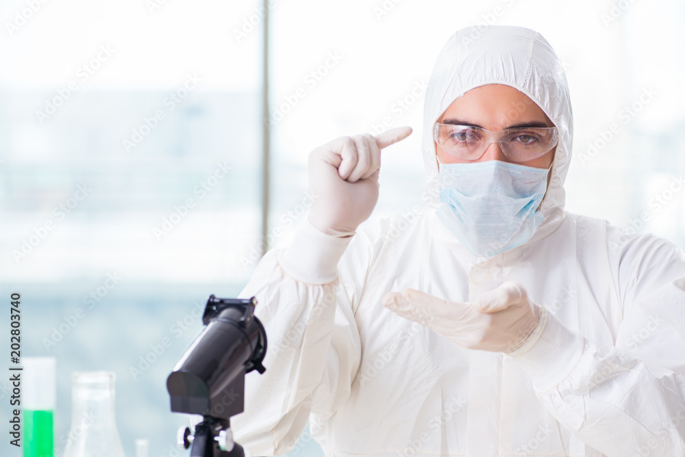 Young chemist student working in lab on chemicals Young chemist student working in lab on chemicals