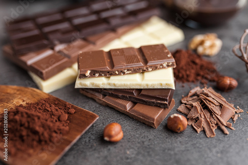 Delicious variety of chocole on rustic background