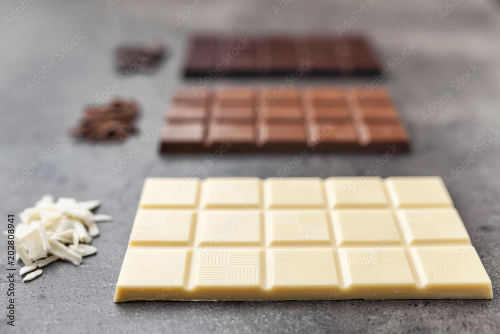 Delicious variety of chocole on rustic background