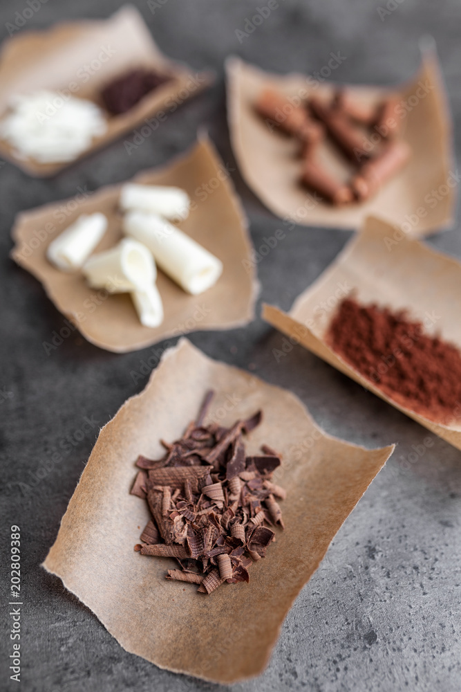 Delicious variety of chocole on rustic background Delicious variety of chocole on rustic background