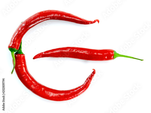 red chili peppers arranged as on off power sign on white background abstract concept photo 