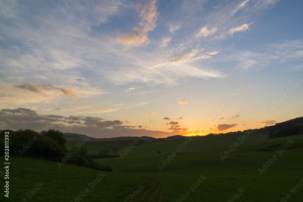 Sunset on meadow with hills and tree. Slovakia Sunset on meadow with hills and tree. Slovakia