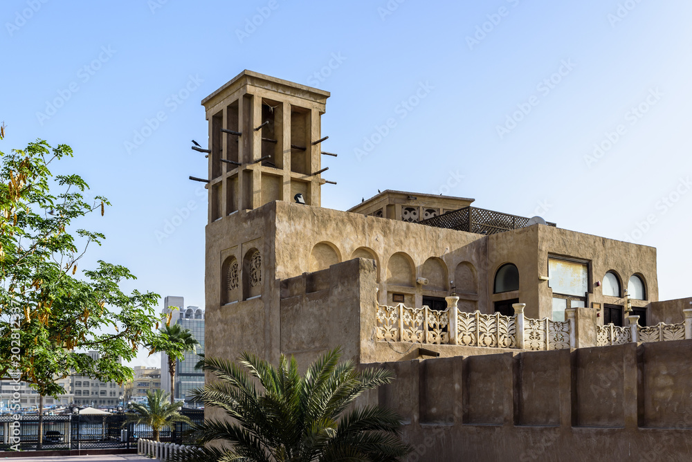 Old buildings in the Bastakia quarter, Dubai.  The buildings are recreations of the old structures around Dubai Creek, and feature wind towers