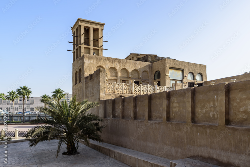 Old buildings in the Bastakia quarter, Dubai.  The buildings are recreations of the old structures around Dubai Creek, and feature wind towers