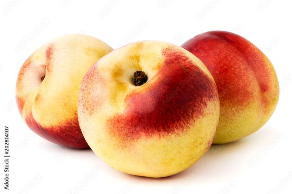 Three ripe nectarines on a white. isolated. Three ripe nectarines on a white. isolated.