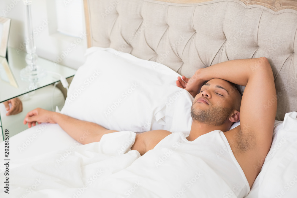 Young man sleeping in bed Young man sleeping in bed