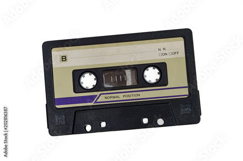 Old audio cassette isolated on white background.