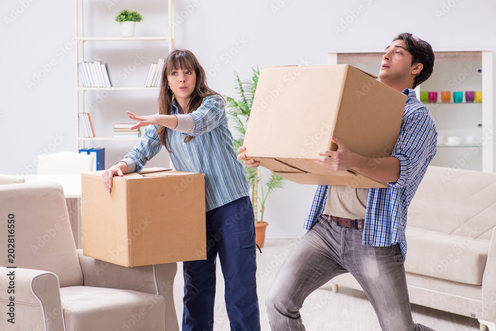 Young family moving in to new apartment after paying off mortgage Young family moving in to new apartment after paying off mortgage