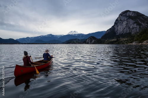 Adventurous people on a canoe are enjoying the beautiful Canadian Mountain Landscape. Taken in Squamish  North of Vancouver  British Columbia  Canada.
