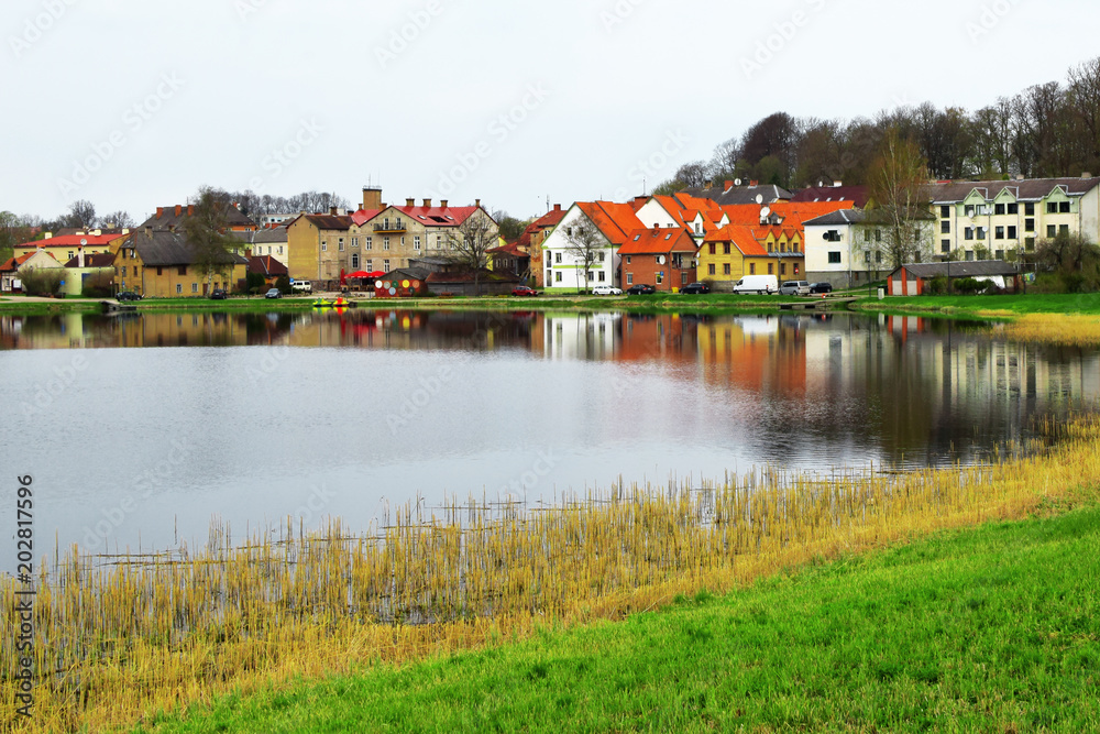 Beautiful old town houses with lake reflection in spring morning in Talsi Latvia. Beautiful old town houses with lake reflection in spring morning in Talsi Latvia.