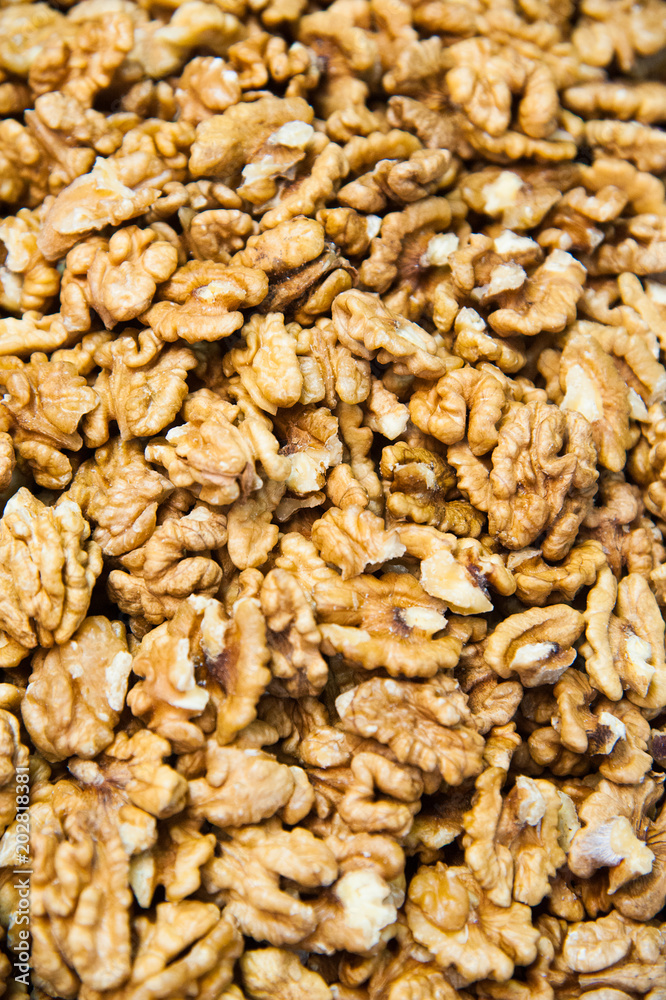 Ripe peeled and dried walnut kernels as background or texture Ripe peeled and dried walnut kernels as background or texture