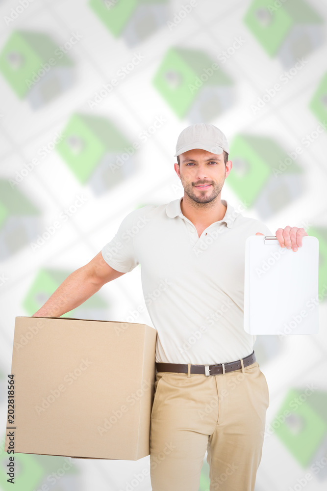Delivery man with cardboard box showing clipboard against green roofed 3d houses Delivery man with cardboard box showing clipboard against green roofed 3d houses