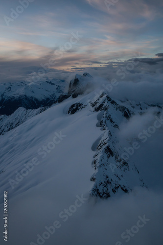 Striking and beautiful snow covered Canadian mountain landscape. Taken from an Aerial perspective North of Vancouver, British Columbia, Canada.