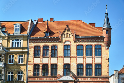 Facade of a historic tenement house in Poznań.