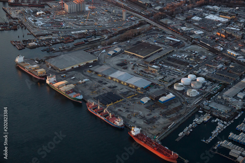 Vancouver, British Columbia, Canada - February 22, 2018: Aerial view of the industrial area in the city during a sunny sunset.