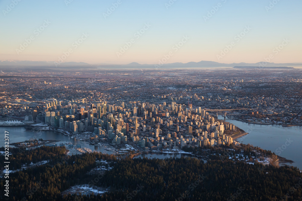 Aerial view of Downtown City during a vibrant sunset. Taken in Vancouver, British Columbia, Canada.
